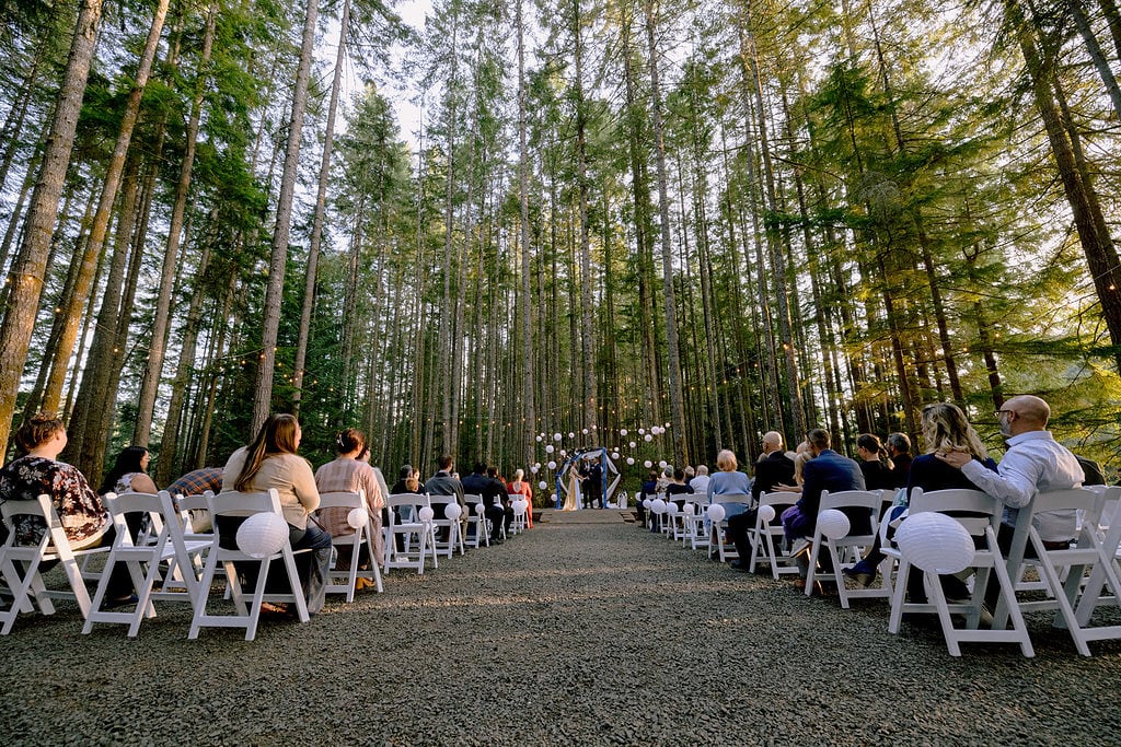 wedding officiant does ceremony in the wood